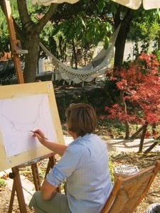 woman drawing in the garden