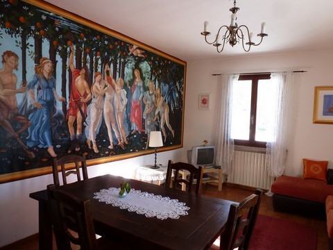 living room with mural of 'Primavera'