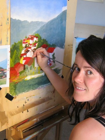 Girl painting a red roofed village