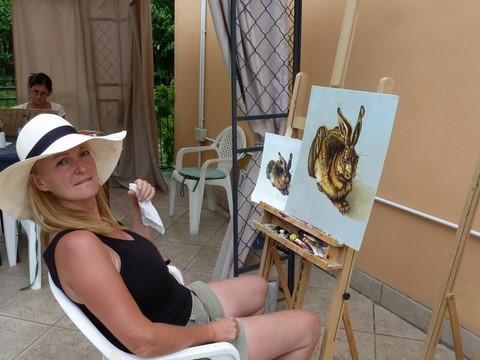 Woman painting a rabbit